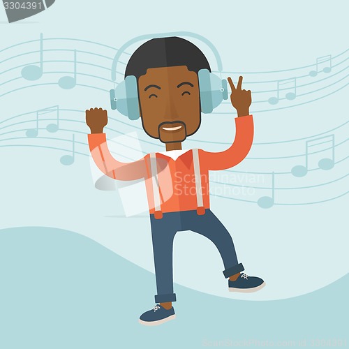 Image of Happy young man dancing while listening to music.