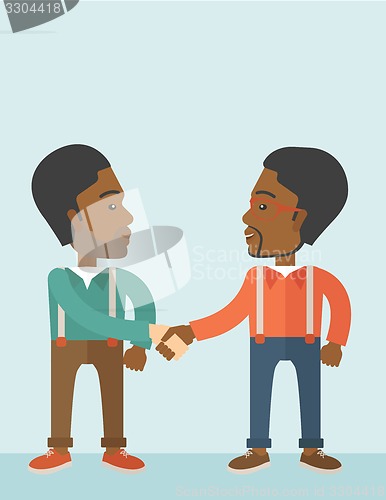 Image of Two African-american guys happily handshaking.