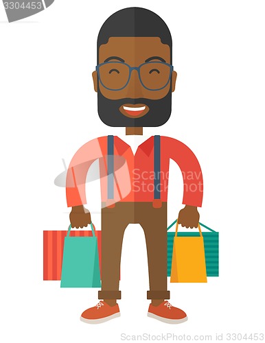 Image of Funny black businessman with shopping bags