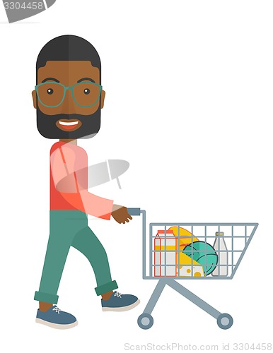 Image of Black Male Shopper Pushing a Shopping Cart.