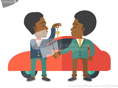 Image of Black man handed a key to other black man.