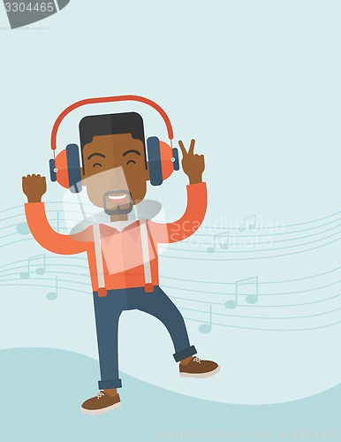 Image of Happy young man dancing while listening to music.