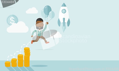 Image of African businessman holding balloons.