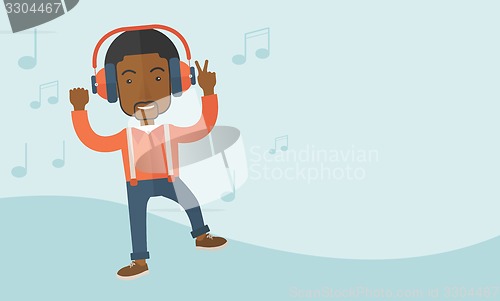 Image of Happy young man dancing while listening to music.