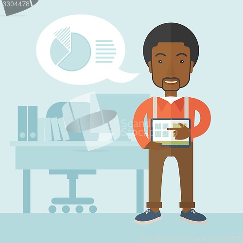 Image of African-american man standing with his tablet.