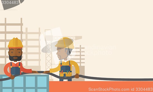 Image of Two black young builders.