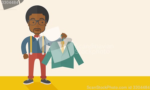 Image of Happy young african man chooses a perfect clothe.