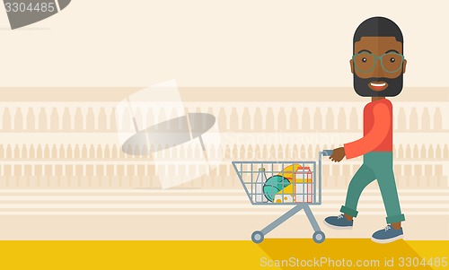 Image of Black Male Shopper Pushing a Shopping Cart.