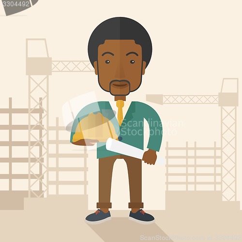 Image of Young african construction worker holding hard hat and blueprint.
