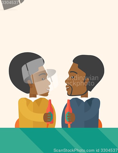 Image of Two black co- workers having fun drinking beer in a pub.