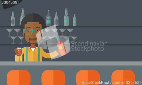 Image of African bartender at the bar holding a drinks.