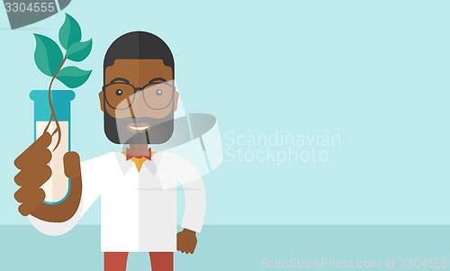 Image of Black guy Chemist with tube and eco leaves.