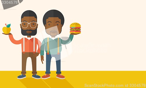 Image of Two black businessmen comparing apple to hamburger.