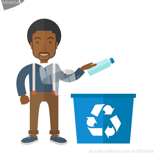 Image of Man throwing plastic container into recycle can