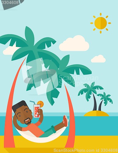 Image of Young black man on th beach relaxing and drinking cocktail.