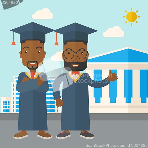 Image of Two black men wearing graduation cap.