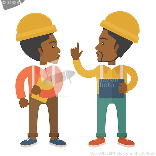 Image of Two black workers talking.