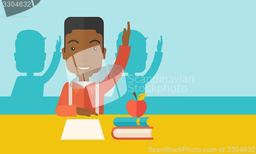 Image of Young black student raising his hand