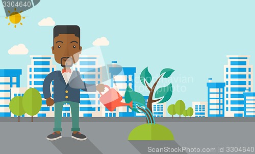 Image of Black guy watering the plant.