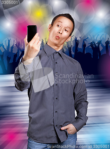 Image of Asian Man Making A Selfie