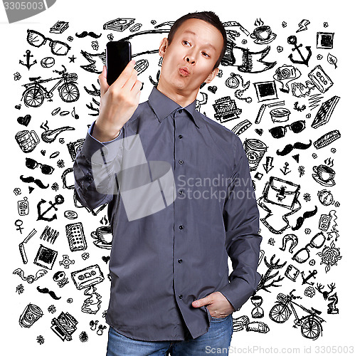Image of Asian Man Making A Selfie