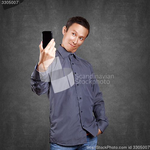 Image of Asian Man Making A Selfie