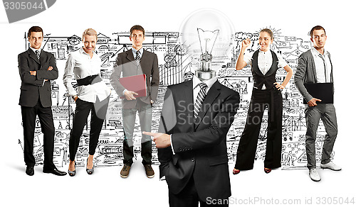 Image of Business Team With Lamp Head