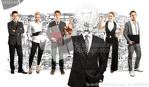 Image of Business Team With Lamp Head