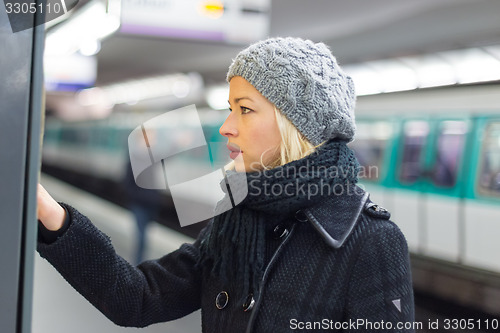 Image of Lady buying ticket for public transport.