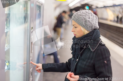 Image of Lady buying ticket for public transport.