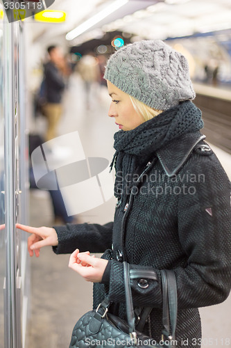 Image of Lady buying ticket for public transport.