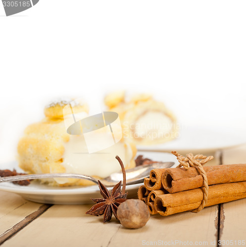 Image of cream roll cake dessert and spices 