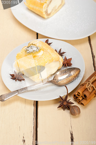 Image of cream roll cake dessert and spices 