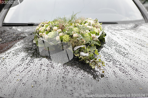 Image of Flower arrangement on car