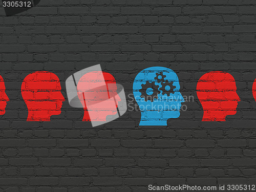 Image of Business concept: head with gears icon on wall background