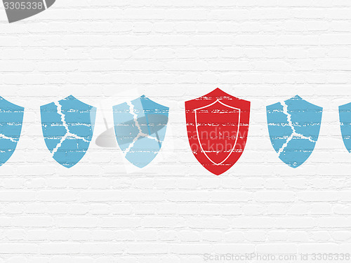 Image of Protection concept: shield icon on wall background