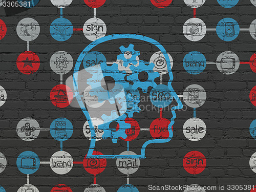 Image of Marketing concept: Head With Gears on wall background