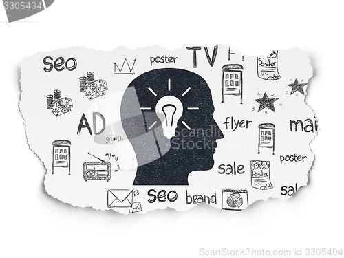Image of Marketing concept: Head With Light Bulb on Torn Paper background