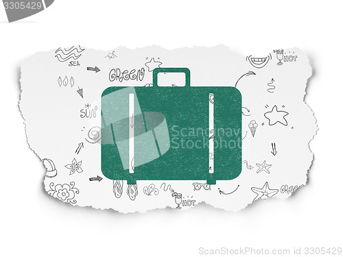 Image of Vacation concept: Bag on Torn Paper background