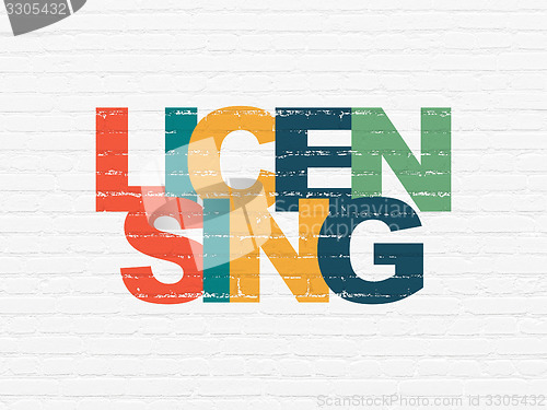Image of Law concept: Licensing on wall background