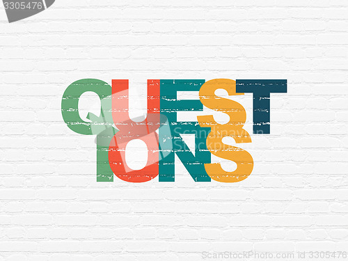 Image of Learning concept: Questions? on wall background