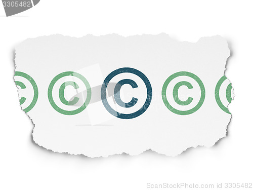 Image of Law concept: copyright icon on Torn Paper background