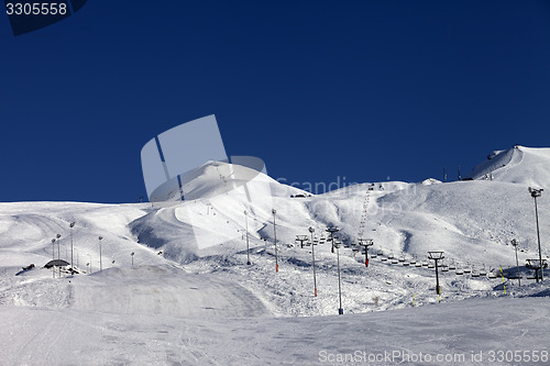 Image of Winter mountains and ski slope at sun day