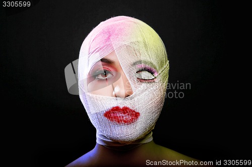 Image of Beauty Concept of Heavy Makeup Seeping Through Gauze