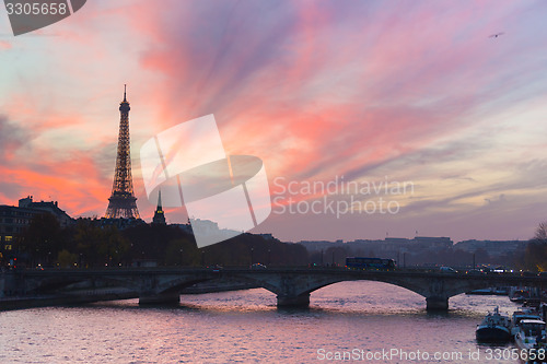 Image of Sunset over Eiffel Tower and Seine river.