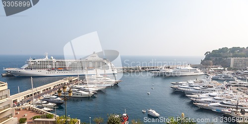 Image of MONTE CARLO, MONACO -  SEPTEMBER 20, 2008: View on Port Hercules with luxurious yachts and a cruise ship REGENT in Monte Carlo, Monaco.