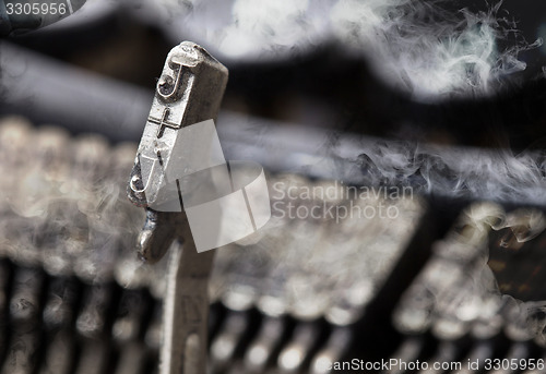 Image of J hammer - old manual typewriter - mystery smoke