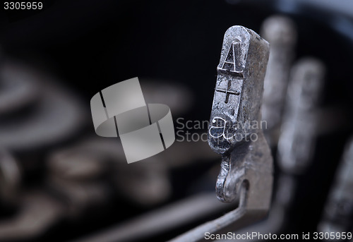 Image of A hammer - old manual typewriter - cold blue filter