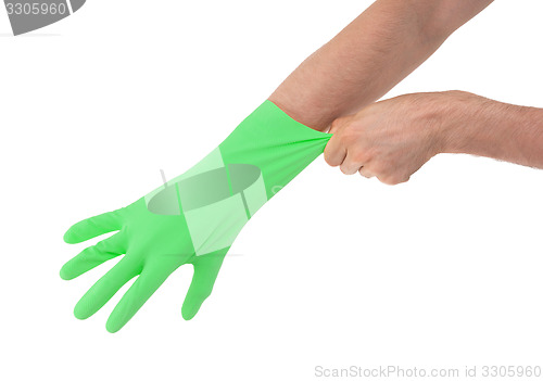 Image of Hand in green glove