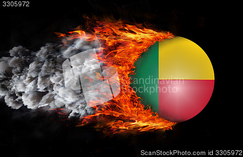 Image of Flag with a trail of fire and smoke - Benin